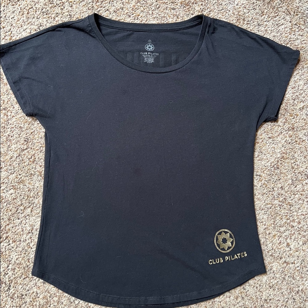 Follow me to Pilates. Size small. ***Slight discoloring on front.  Club Pilates.